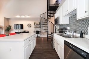 The staircase is a masterpiece of architectural design, meticulously crafted to blend seamlessly with the open floor plan, creating a sense of fluidity and spaciousness. With each step, you ascend into a world of elegance and charm.