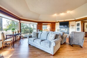 Living Room | Tree-Lined Bay Views | Gas Fireplace