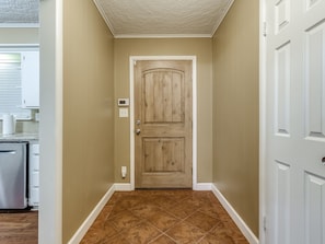 The secondary front door is the best one to bring luggage into & out of the home