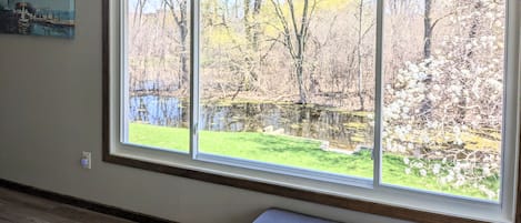 Panoramic view to the spacious backyard with creek for you to enjoy!