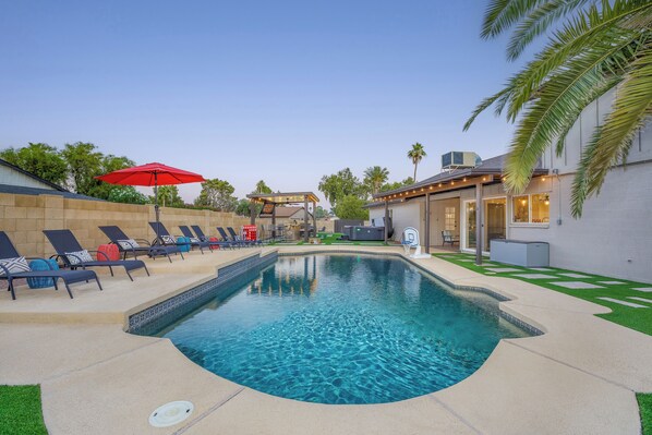Relax in your private Scottsdale oasis featuring a sparkling heated pool!