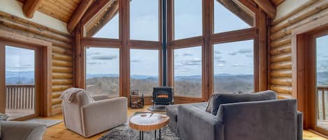 Panoramic Mountain Views from the Living Room with a Wood Stove
