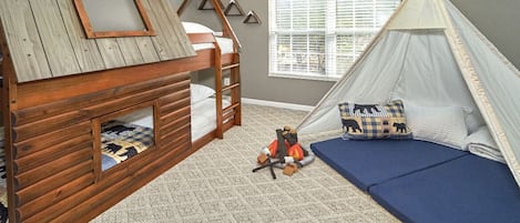 Log cabin bunk bed and a large teepee that can comfortably sleep 2 children.