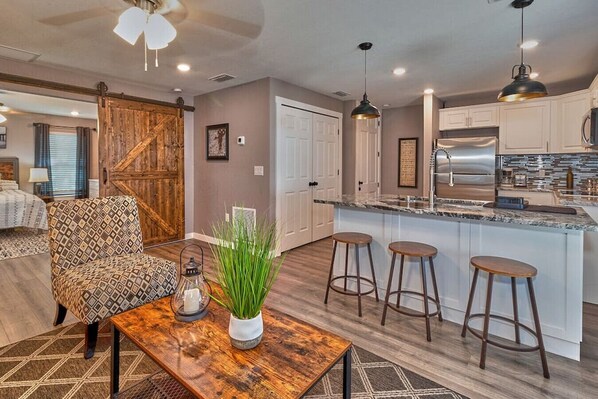 The living room is very spacious and located next to the kitchen