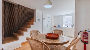 Unique cork-textured wall leads to the upper level, blending natural materials with modern design. #ModernDesign #NaturalTextures