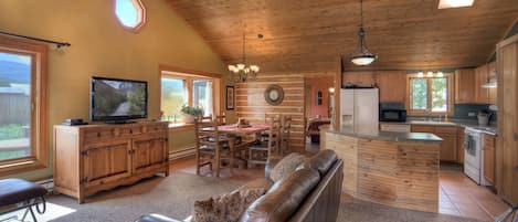 Spacious living room with smart tv and wood burning stove