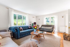 Springhill, Blandford Forum: The sitting room with triple aspect windows allowing the light to flood in