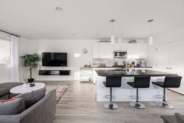 Living area and kitchen with bar-style seating