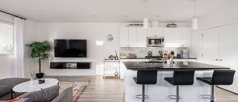 Living area and kitchen with bar-style seating