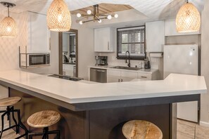 Beautiful kitchen with stools for extra seating