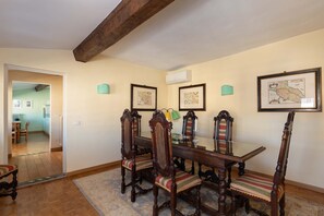 Tuscan wood dining table can seat 8 to 10 people.