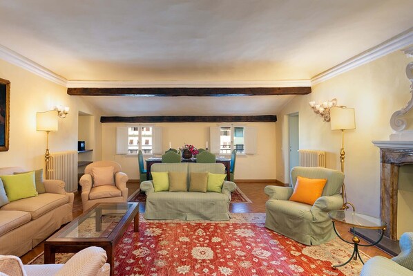 Living room windows overlook the piazza.