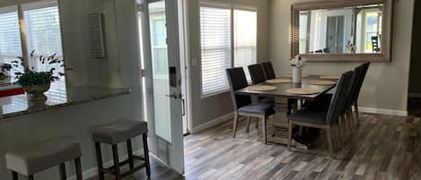 Dining area with wrap around deck and access to river view with cantilever deck 