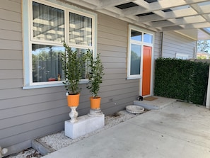 Private entrance and covered car port parking space