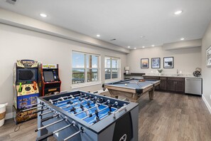 Lower level rec room w/pool table, foosball, 1 arcade. (NO BUCKHUNTER GAME)