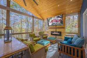75" Screen. View of woods and (downhill) Oconee River. Electric fireplace.