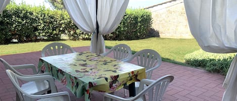 Garden for private use with gazebo, table and chairs