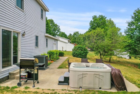 Outdoor Retreat: Soak in the hot tub and grill up a feast surrounded by nature’s beauty!