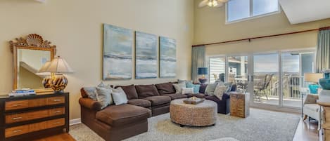 Expansive 2 story family room with views of the Gulf