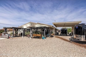 Fenced back yard. Grill, brick fire pit, misters, covered patio, room to relax