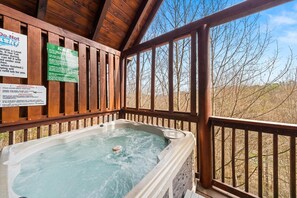 Hot tub on main level overlooking forrest.