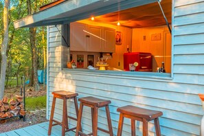 The game room connects to the firepit and the inviting outdoor area. It's like having a window into the cool and exciting world outside