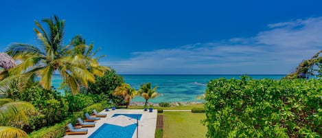 Oceanfront views with pool area, garden, and outdoor furniture