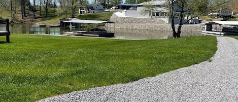 Parking and walkway for guest to the dock and Lake access and a slip