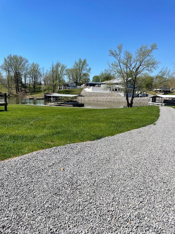 Parking and walkway for guest to the dock and Lake access and a slip