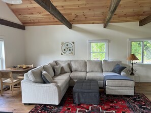 U shaped sofa with game table