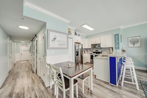The fully equipped kitchen features granite countertops, stainless-steel appliances, and has everything you need to prepare meals for family & friends.