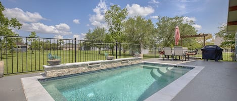 Spa pool (8' x 18' 3'6" to 4'6" deep)  with outdoor seating/grill.