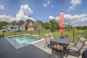 Outdoor table and additional seating behind and to the left