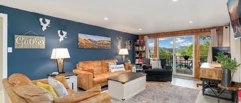 Welcome!   Main level living/tv room with fireplace, tv and desk