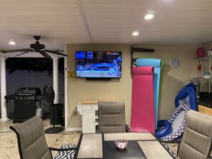 Cabana with DirecTV, rafts, ice maker, table, chairs, blender, sink, towels