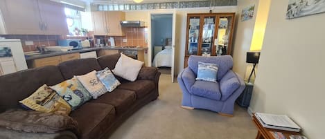 Comfy sitting room with kitchenette. 