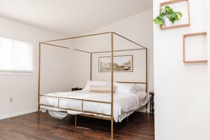 Unwind in our gorgeous bedroom featuring a comfortable mattress perfect for a restful night's sleep.