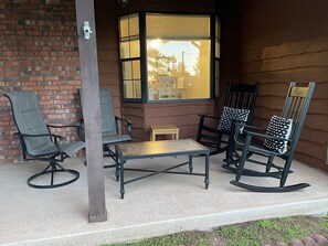 Front porch has seating for 8.