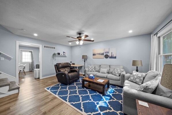 A cozy, modern space with natural light, comfy seating, and stylish decor.