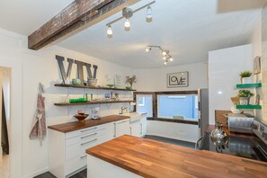 Kitchen with plenty of supplies for cooking, eating & enjoying