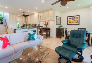 Stepping inside, guests are welcomed by a spacious living room which showcases tropical views from every window 