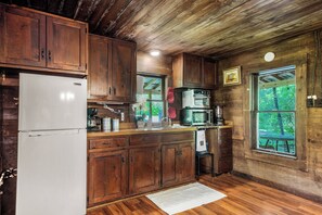 Kitchen modernized with refrigerator,  microwave, multi-function oven, and more