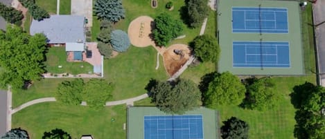 Property sits exclusively inside a park includes Pickleball, Tennis, Playground
