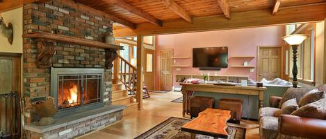 Cozy sitting area with wood burning fireplace