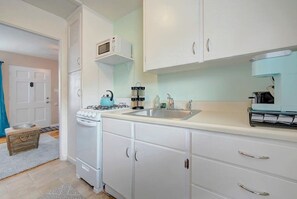 Clean and well stocked kitchen, ready for cooking. Supplied with dishes, cookware, microwave, Keurig coffee maker, toaster, spices, olive oil, and many other essentials.