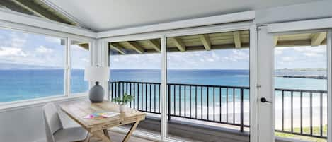 Be inspired by 180 degree ocean views from the master bedroom's study area