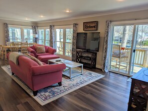 Open concept kitchen/dining/living room with views of the lake
