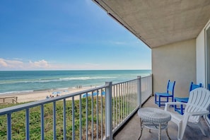 A stunning ocean view from the balcony, where you can relax and watch the waves roll in.