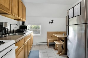 Kitchen With Updated Black Fixtures, Pots, Pans, Flatware, Plates, Glasses including Stemless Wine Glasses!
