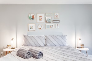 Primary Suite with comfortable king sized bed.